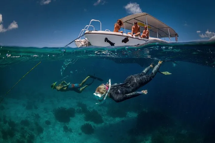 Drift snorkelers off Klein Bonaire following a guide on a Double Dip Bonaire snorkeling tour